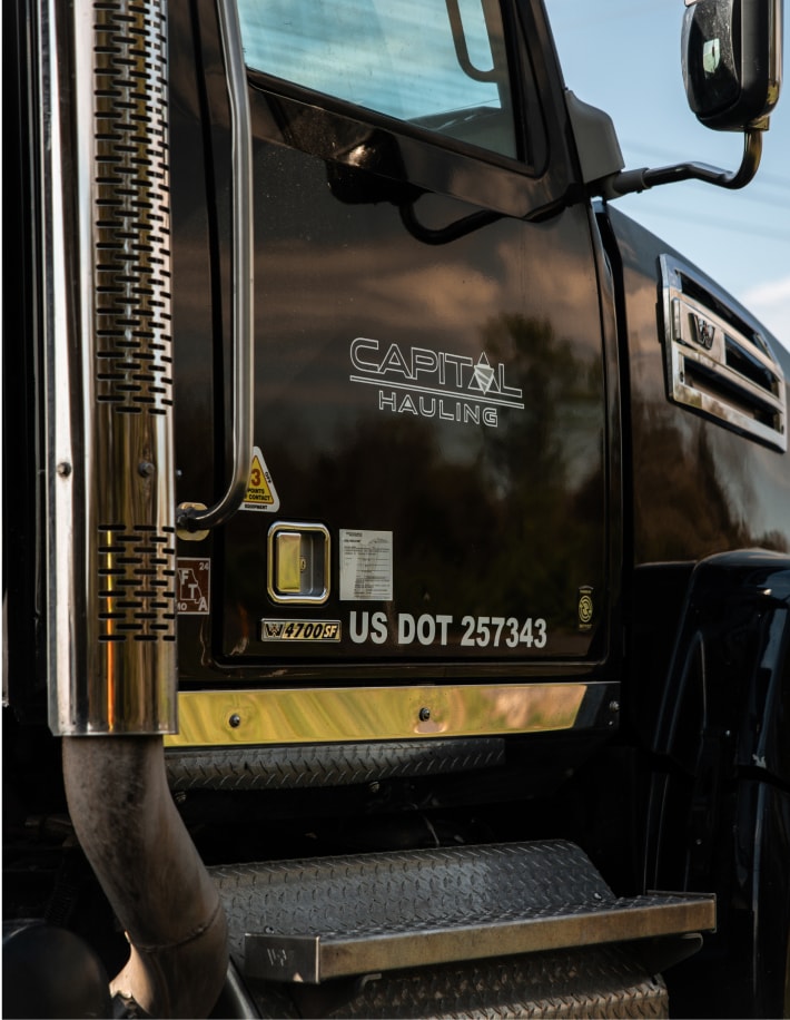 Side of a Capital Hauling truck