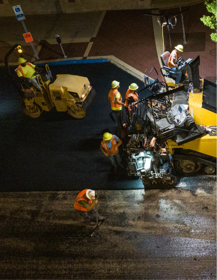 Overhead view of road paving machine and roller