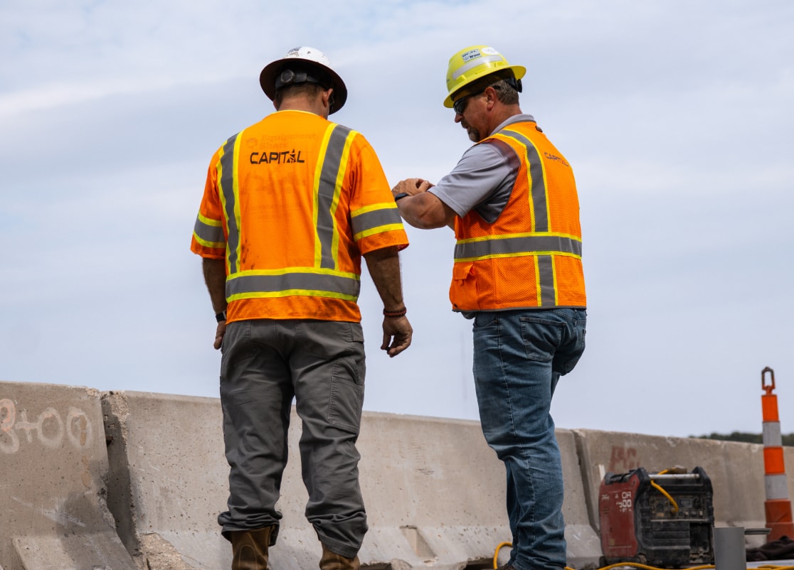 Two construction workers in a discussion