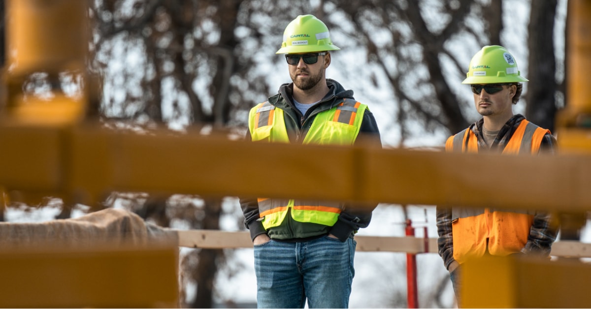 Construction workers overseeing a project