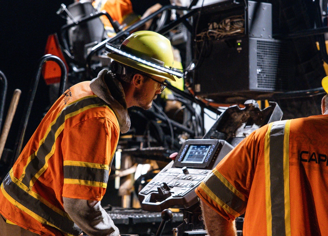 Capital paving crew member during roadway construction project